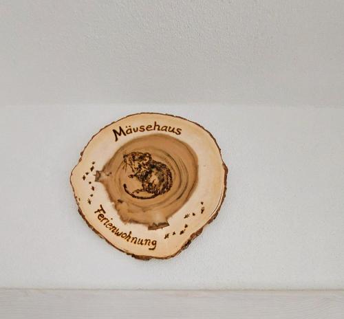 a iced donut with the word mitzacs on it at FeWo Mäusehaus ID 16291-7 in Kargow