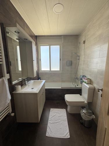 a bathroom with a sink and a toilet and a shower at Blue House- Peaceful Mountain Escape in Mazraat et Teffâh