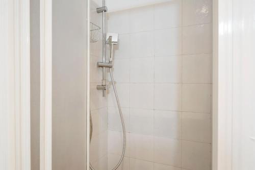 a shower with a glass door in a bathroom at Fontanine House in Rapallo