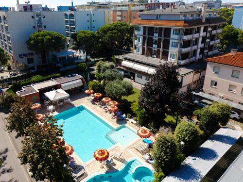 an overhead view of a swimming pool in a city at Hotel Ariston in Bibione