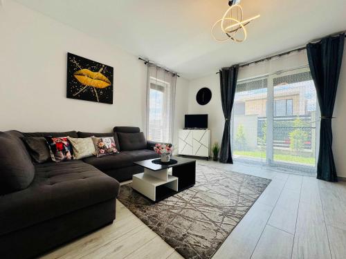 a living room with a couch and a table at Joy City Stay Lavandei 2 in Timişoara
