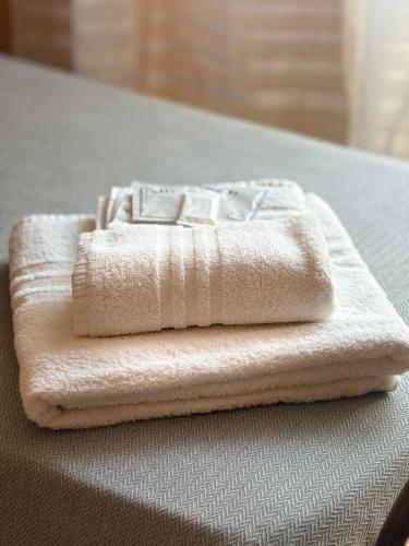 a white towel sitting on top of a table at B&B Ducato delle Seimiglia in Camaiore