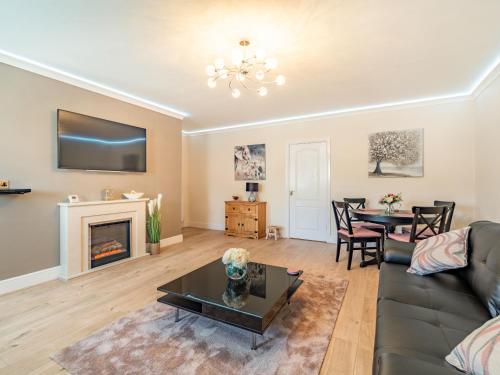 a living room with a couch and a table at Squirrel Cottage - Uk37886 in Stanhope