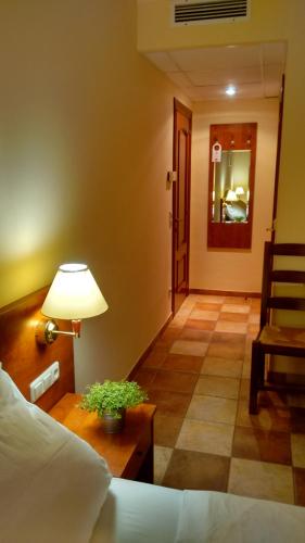 Ένα ή περισσότερα κρεβάτια σε δωμάτιο στο Aparthotel Lekavski