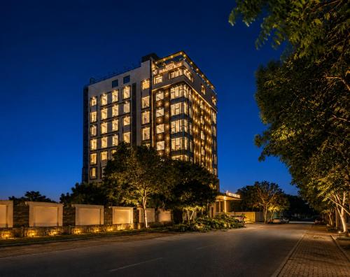 a tall building on a street at night at Paradise Bliss Udaipur - Luxury Boutique Hotel in Udaipur
