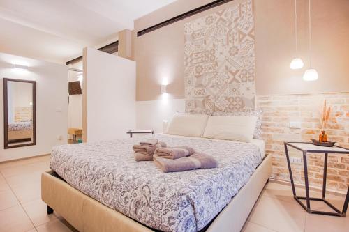 a bedroom with a bed with two teddy bears on it at B&B Fontanella 32 in Porto SantʼElpidio