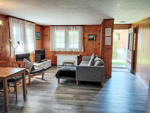 a living room with a couch and a table at Apartment Ritz by Interhome in Ernen
