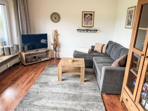 a living room with a couch and a coffee table at Apartment Panorama by Interhome in Berghofen