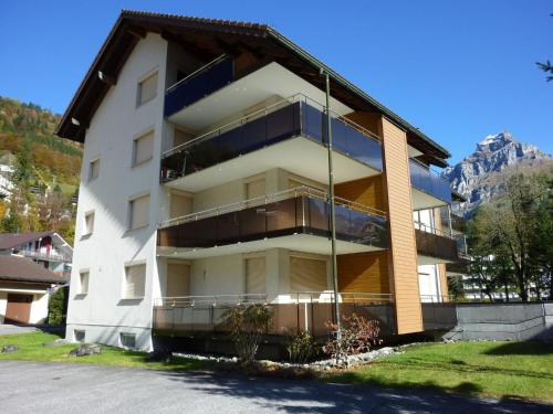 a building with balconies on the side of it at Apartment Blumenweg 6 by Interhome in Engelberg