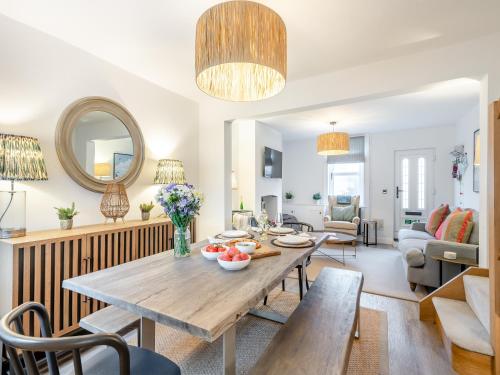 a living room with a table and chairs at Big Skies in Lowestoft