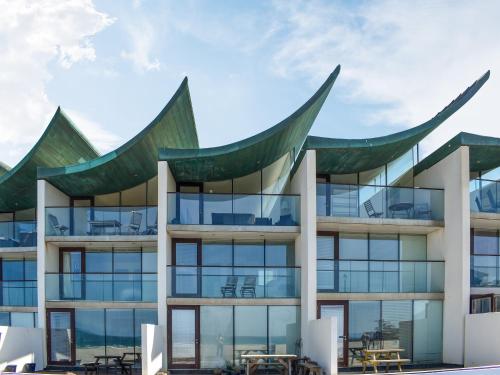 an architectural rendering of a building with large windows at The Balcony in Westward Ho