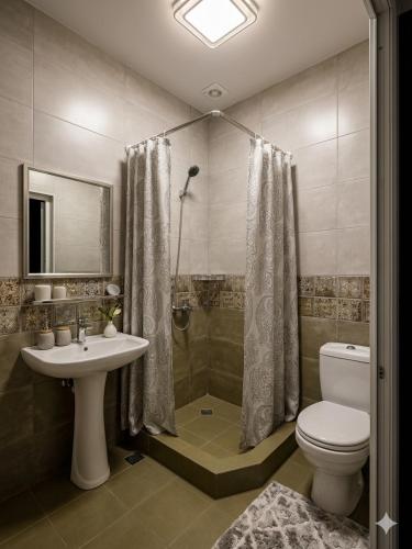 a bathroom with a toilet and a sink and a shower at Guest House Kobuleti 516 in Kobuleti