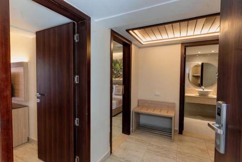 a bathroom with a sink and a mirror at Ali Baba Palace Resort - Families and Couples Only in Hurghada
