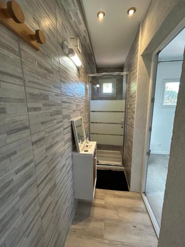 a bathroom with a sink and a wall at F2 Ismaël in Solliès-Pont