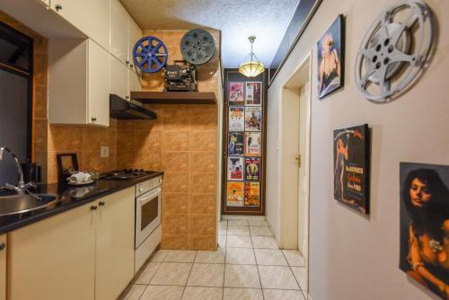 a kitchen with a sink and a counter top at Villa Simonne in Johannesburg
