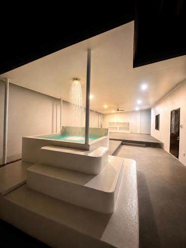 a bathroom with a fountain in the middle of a room at DOS Unica Hija Hometel by TahZora in Valencia
