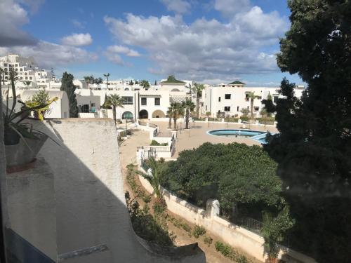 a view of a courtyard from a building at Vue superbe in Port El Kantaoui