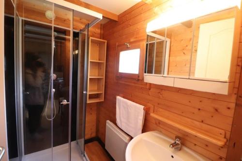 a bathroom with a shower and a toilet and a sink at Camping de Saint Just - Onlycamp in Arcomie