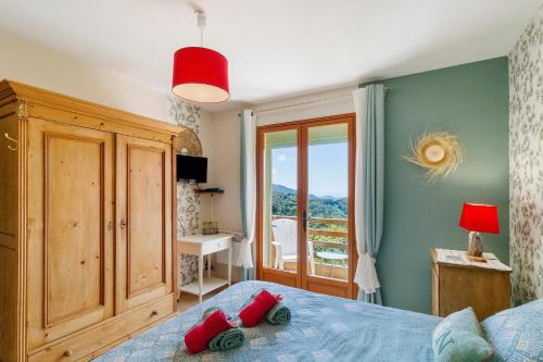 a bedroom with a bed with red pillows on it at Gite Mare e Monti in Vico