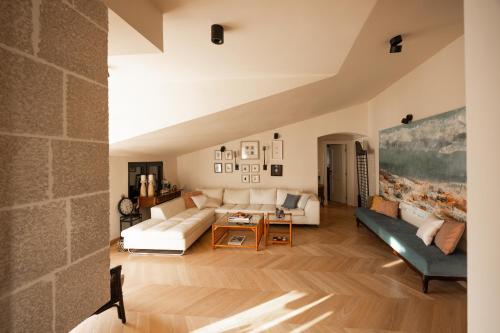 a living room with a couch and a table at Mamei Boutique Villa in Dobrota