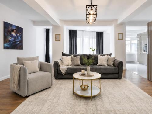 a living room with a couch and a table at Pop Up Aparthotel in Bucharest