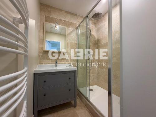 a bathroom with a shower and a sink and a toilet at GC - Le Caps des Dunes - Centre in Wissant