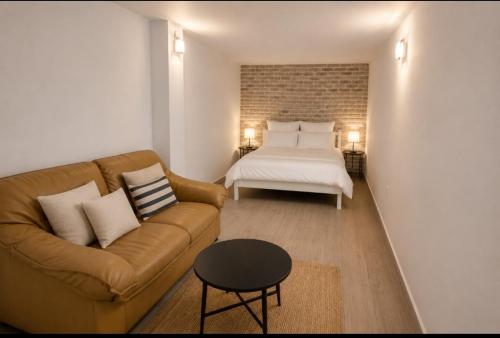 a living room with a couch and a bed at Apartman Taraca Villa Knezevic in Herceg-Novi