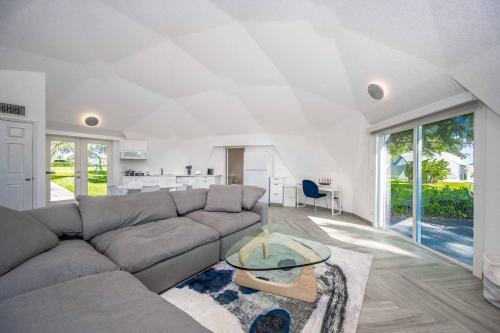 a living room with a couch and a table at Sumner Lake Tiny House 1B in Clermont