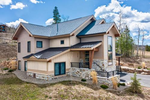a house with solar panels on it at 238 Night Hawk Home in Granby
