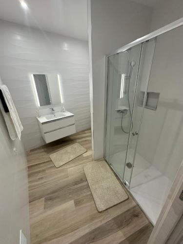 a bathroom with a shower and a sink at Apartamento As T3 Pombal in Pombal