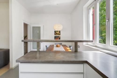 a kitchen with a counter top and a table at Apartment Gerwies in Bronzolo