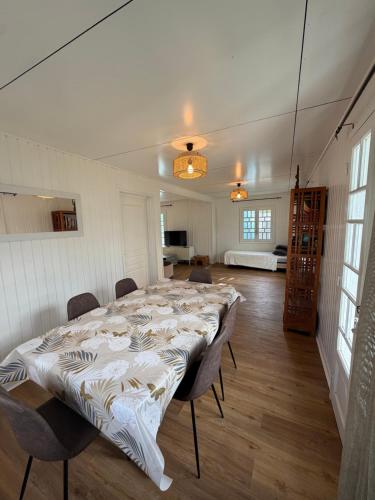 a large white room with a large bed in it at Maison de Charme tout confort in Saint-André