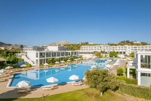 an aerial view of a hotel with a large swimming pool at Levante Athletic Resort in Afantou
