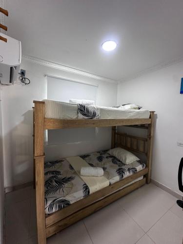a couple of bunk beds in a room at Lohana's House Beach in Cartagena de Indias