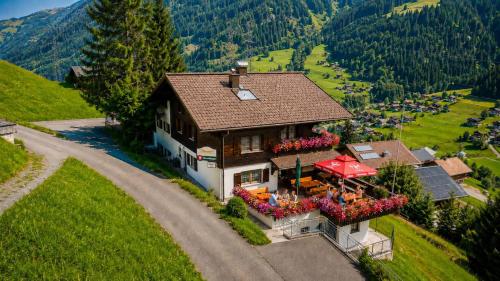 an aerial view of a house in the mountains at Alpinchalet Zigjam in Gaschurn