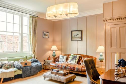 a living room with a couch and a chair at 1 Bed in Elstronwick oc-e42580 in Burton Pidsea