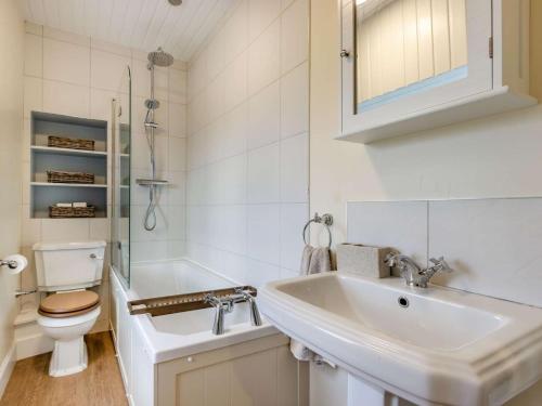 a white bathroom with a sink and a toilet at 2 Bed in Arbroath oc-90316 in Inverkeilor
