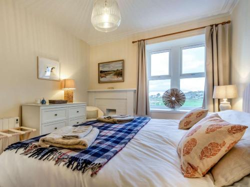 a bedroom with a bed with towels on it at 2 Bed in Arbroath oc-90316 in Inverkeilor