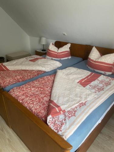 two twin beds with pillows on them in a room at Haus Else am Nationalpark Eifel in Schleiden
