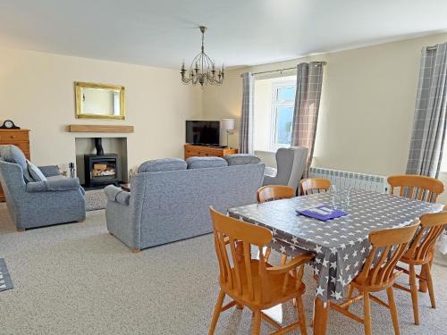 a living room with a table and chairs at The Martin's - Uk48870 in Belford