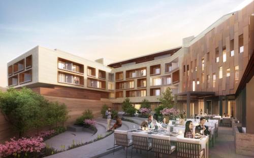 a rendering of a building with people sitting at tables at Hotel Chaco in Albuquerque