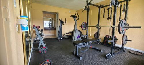 a gym with several exercise equipment in a room at Paramount Lakeside Inn & Suites in Lakeland