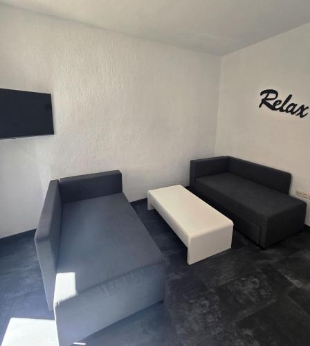 a living room with a couch and a coffee table at EXCELSIOR Apartments Rovinj in Rovinj