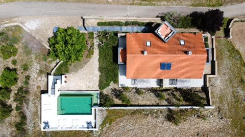 an overhead view of a house with an orange roof at Casas da Fontanheira in Marvão