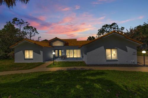 a rendering of a house at dusk at SWISS 101 - Lake Olsen in Clermont