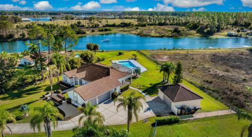 an aerial view of a house with a lake at SWISS 56 - Lake Denise in Clermont