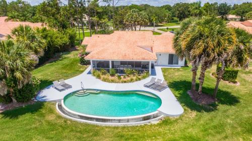 an aerial view of a house with a swimming pool at SWISS 57 - Lake Denise in Clermont