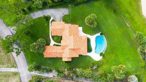an overhead view of a house with a roof at SWISS 30 - Golf Course in Clermont