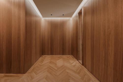 a room with wooden walls and a wooden floor at Woodline Suite in Luxembourg