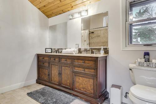 a bathroom with a wooden sink and a toilet at Hiking, Wineries & More! Mtn-View Gem in Tehachapi in Tehachapi